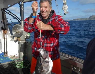 Wayne Smith with a grouper caught while on a charter with Owenga Charters